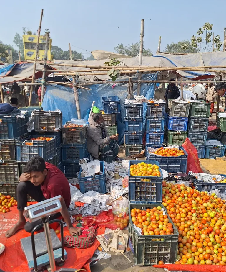 Produce moving through a wholesale market in Bangladesh