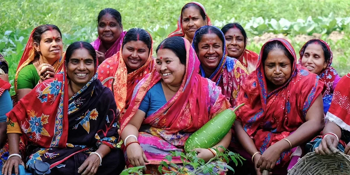 Women gathered around agricultural produce in coastal Bangladesh